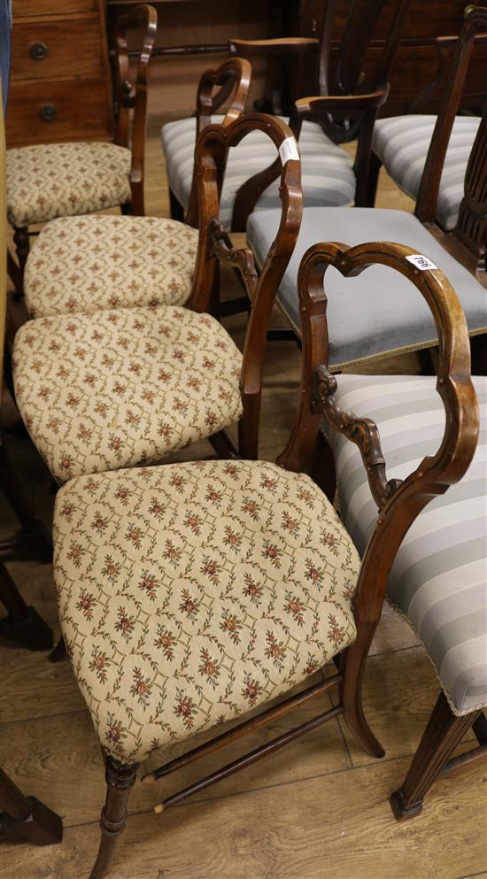 A set of four Victorian cared walnut bedroom cahirs